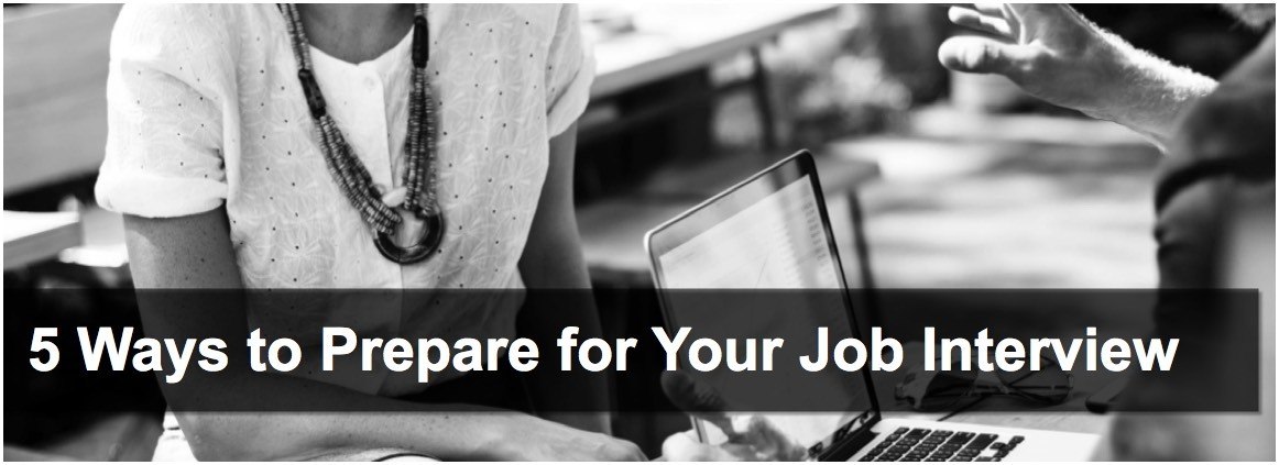 man and woman having a job interview over a Macbook