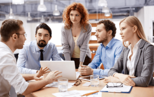 group of people in their suits discussing among each other 